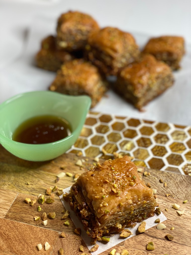 Delicious squares of homemade greek baklava with agave syrup.