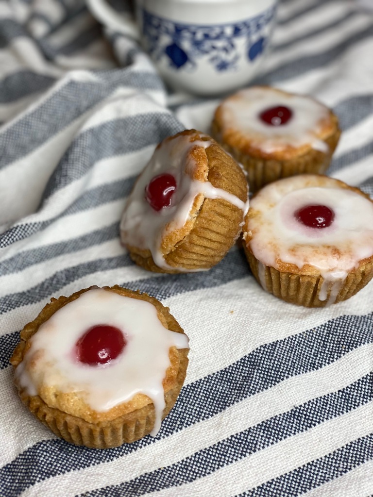 Cherry bakewell tartlets served with afternoon tea.
